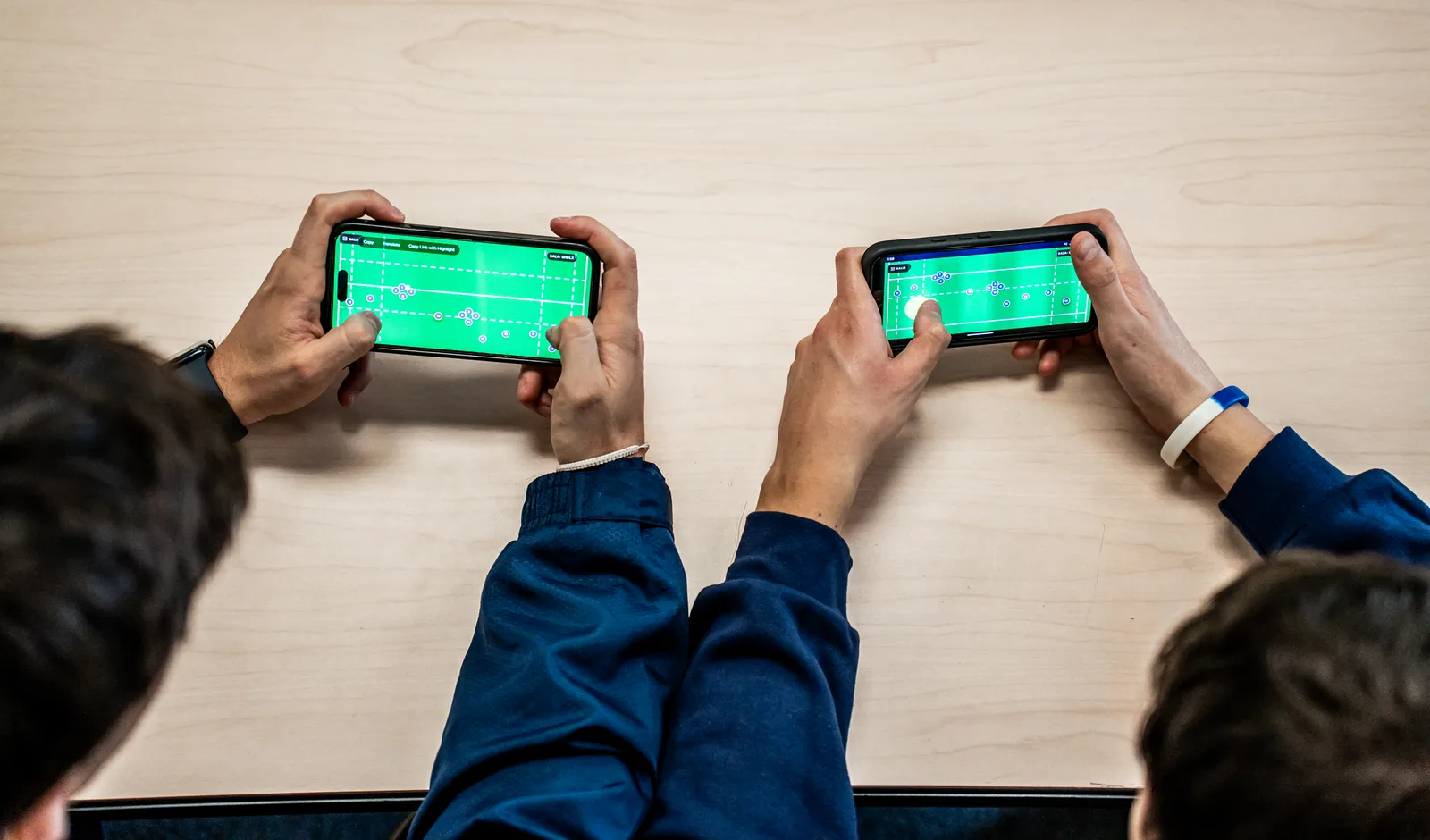 Coach pushing a play from the library to the live board during field execution