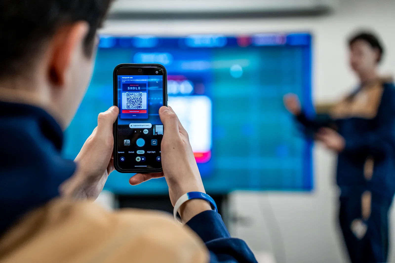 Players scanning a session QR code to connect their mobile gamepads